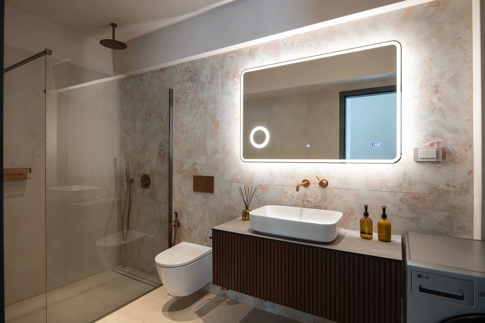 The stone-finished main bathroom