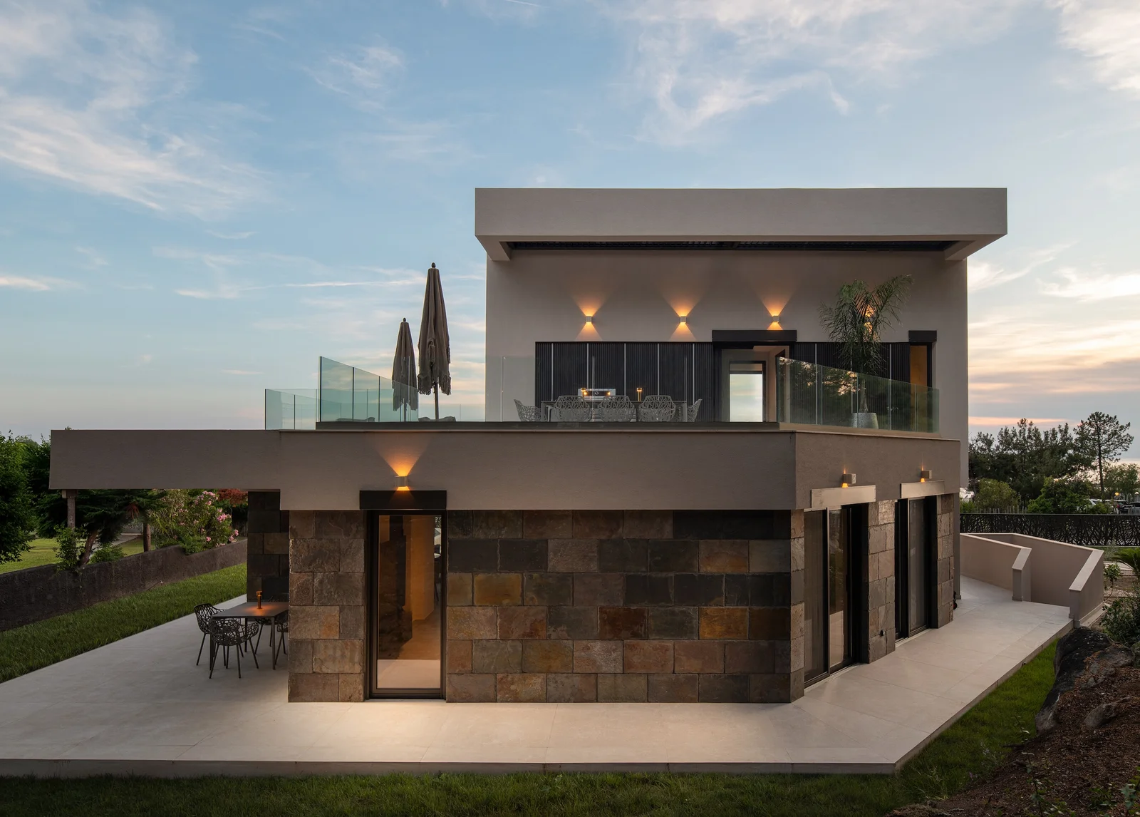 Villa Elyon glowing at twilight